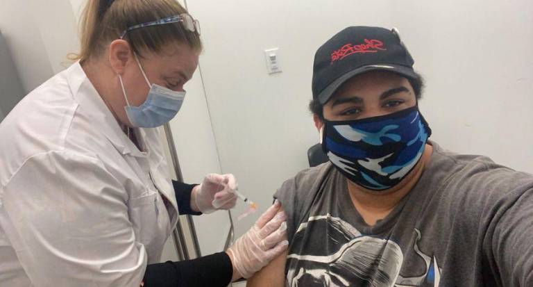 West Milford, N.J., resident Coty DeFreese takes a selfie while getting vaccinated on Jan. 7. Since states began expanding eligibility the week of Monday, Jan. 11, area residents have struggled to find available COVID-19 vaccination appointments. Photo provided.