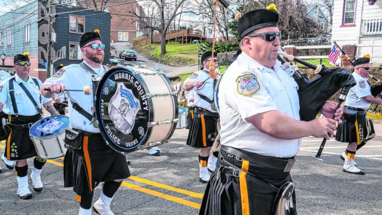 Members of the Police Pipes and Drums of Morris County play as they march in the St. Patrick’s Day Parade on Saturday, March 16 in Newton. (Photos by Nancy Madacsi)