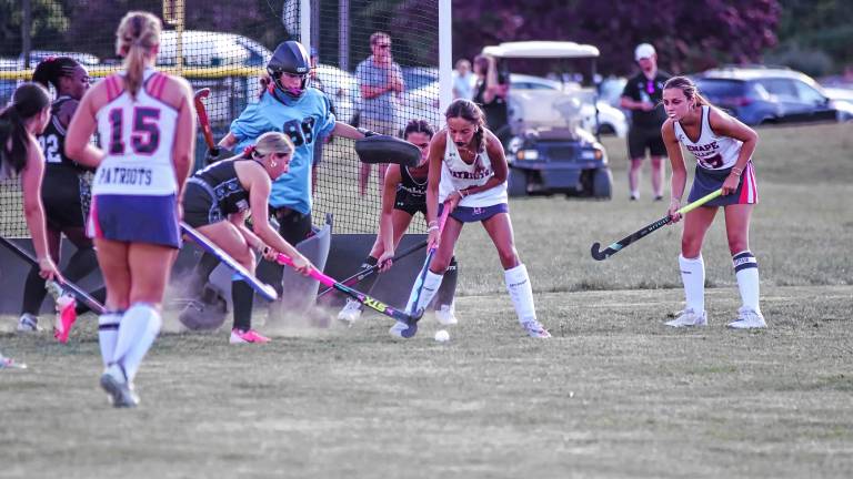 Lenape Valley and Wallkill Valley field hockey players battle for control of the ball in front of the goal during the season-opener Sept. 3 in Hamburg. The Patriots won, 2-0. (Photos by George Leroy Hunter)