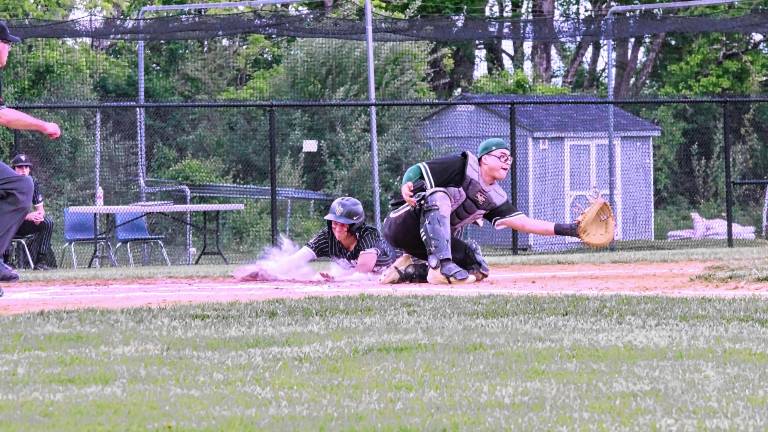 Wallkill Valley runner Chris Collins slides safe onto home plate to score in the second inning of the game against New Milford on Thursday, May 29. The Rangers won, 10-0, and advance to the semifinal round of the NJSIAA North Jersey, Section 1, Group 1 tournament Tuesday, June 3 at Pequannock. (Photos by George Leroy Hunter)