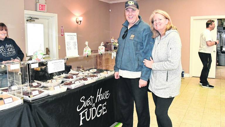 Susan and Mike Winge of Highland Lakes are shown by Sue’s House of Fudge.