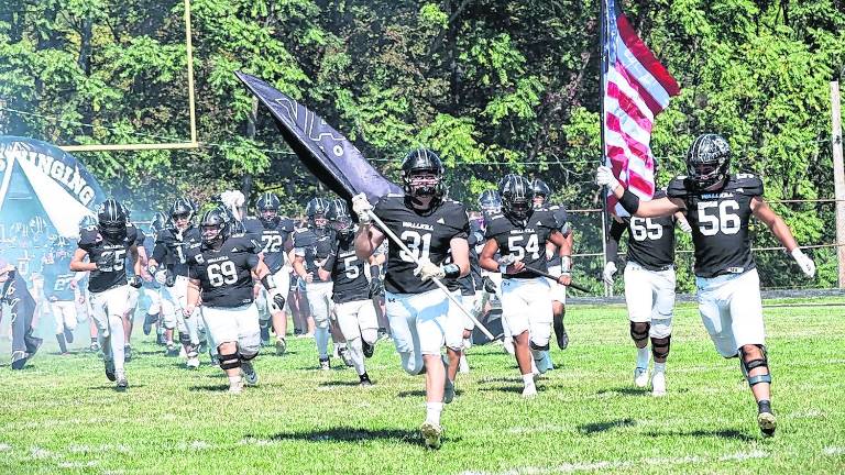 The Wallkill Valley football team takes the field.