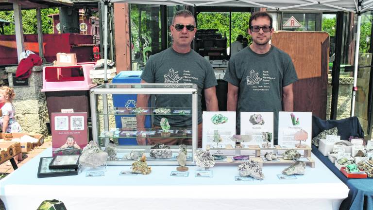 Anthomy Tomaselli of Ancient Crystal Earth and Deavid Lerman of David's Minerals pose for a photo.