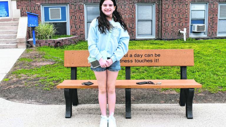 Olivia Verpent of Franklin stands by a chalk drawing.