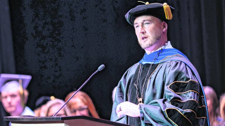 <b>Dr. Cory Homer, SCCC president, addresses the audience at his inauguration ceremony.</b>