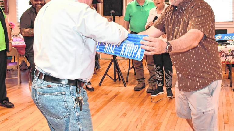 Mike Krupa of Franklin, left, accepts his honor as Senior of the Year.