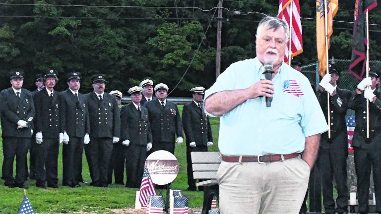 Phil Crabb, former chief of the Franklin Fire Dept., gives a speech.