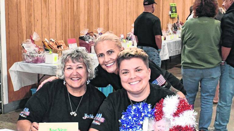 Joey Luchetti's daughters and his wife, Nancy Luchetti Metlter poses with Heather and Caitlin.