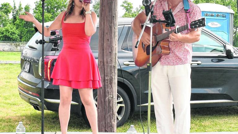 October Rose performs on stage.