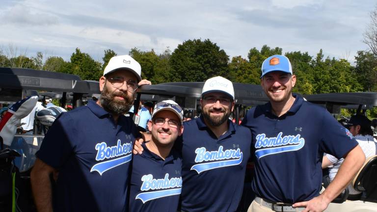 Michael Diaz of Cedar Grove, Ian Wallace of Parsippany, Tom Worgul and Michael Lewis of Parsippany pose for a photo.