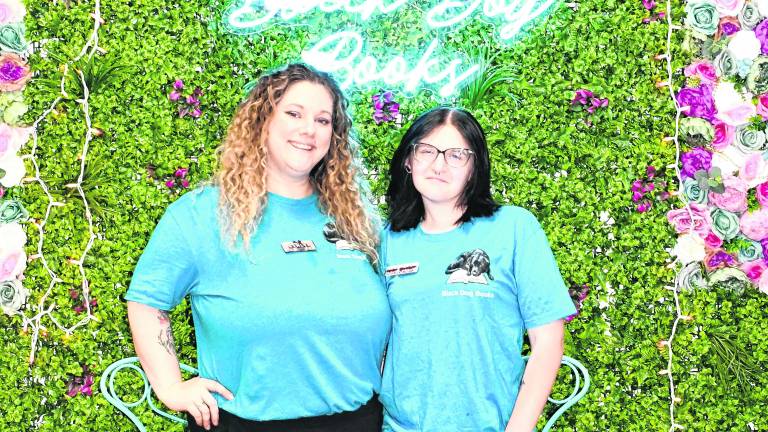 Ashlyn Szilva, owner, and Maya Gordon, assistant manager, of Black Dog Books in Lafayette pose for a photo.