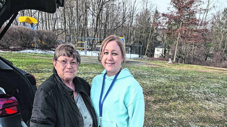 <b>Pictured during the presentation are Carolyn King, a Rotary member, and Sue Andriola of Ogdensburg Elementary School.</b>