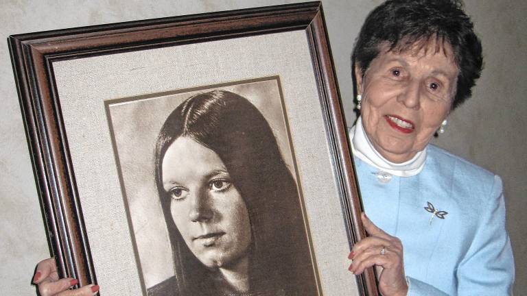 Julia Quinlan holds a photo of her daughter Karen Ann, who died in 1985. (Photo provided)