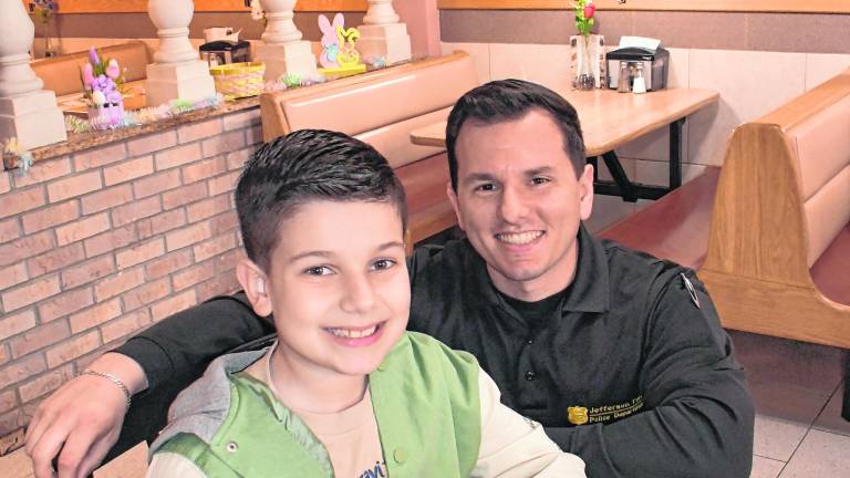 Det. Lundrim Veliu poses with Driton Mill.