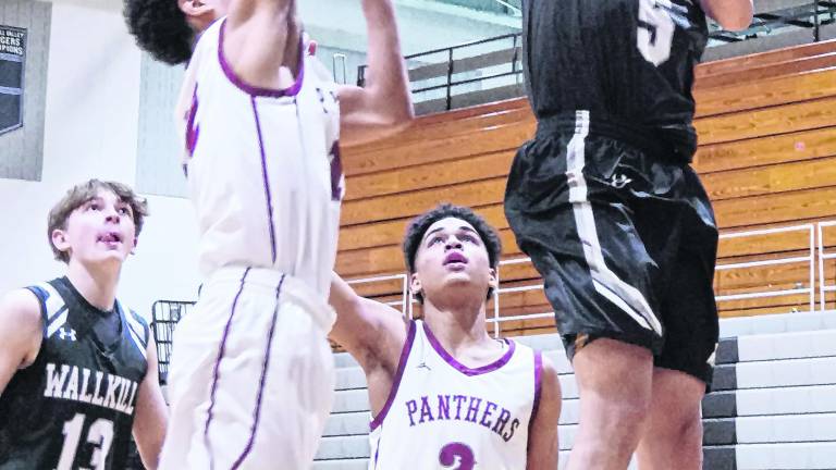 Wallkill Valley's Gavin Solano raises the ball towards the hoop during a shot. Solano scored 25 points.